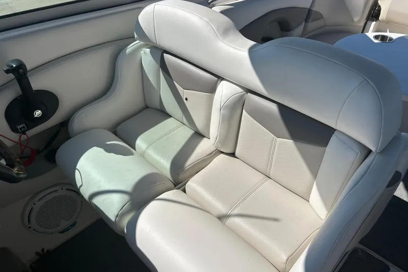 Slide: The Image of 2008 Chaparral 275 SSi boat interior with beige leather seating and cup holder. - 35