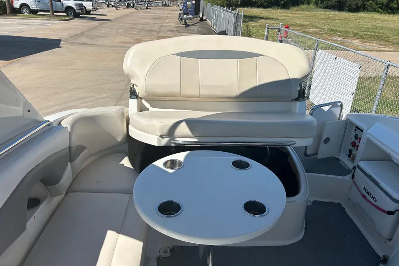 Slide: The Image of 2008 Chaparral 275 SSi boat interior with seating and round table. - 37