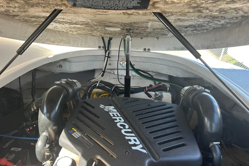Slide: The Image of Engine compartment of a 2008 Chaparral 275 SSi boat, featuring a Mercury engine. - 41