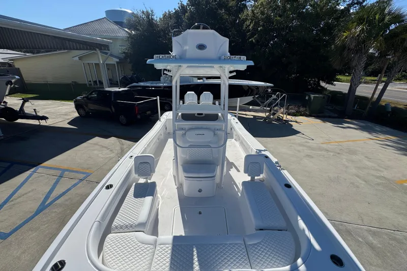 Slide: The Image of 2026 Caymas 281 HB boat with spacious deck and modern design in a sunny outdoor setting. - 27