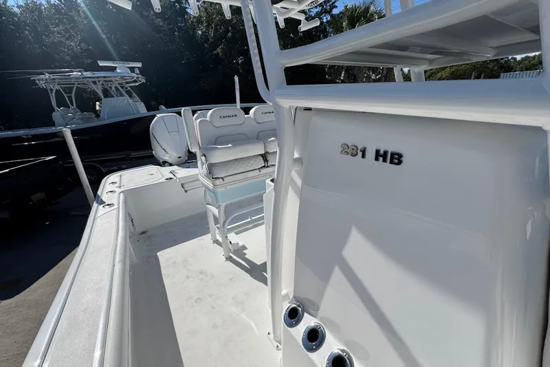 Slide: The Image of 2026 Caymas 281 HB boat interior with seating and console details. - 30