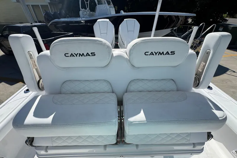 Slide: The Image of 2026 Caymas 281 HB boat seats with white upholstery and logo. - 32