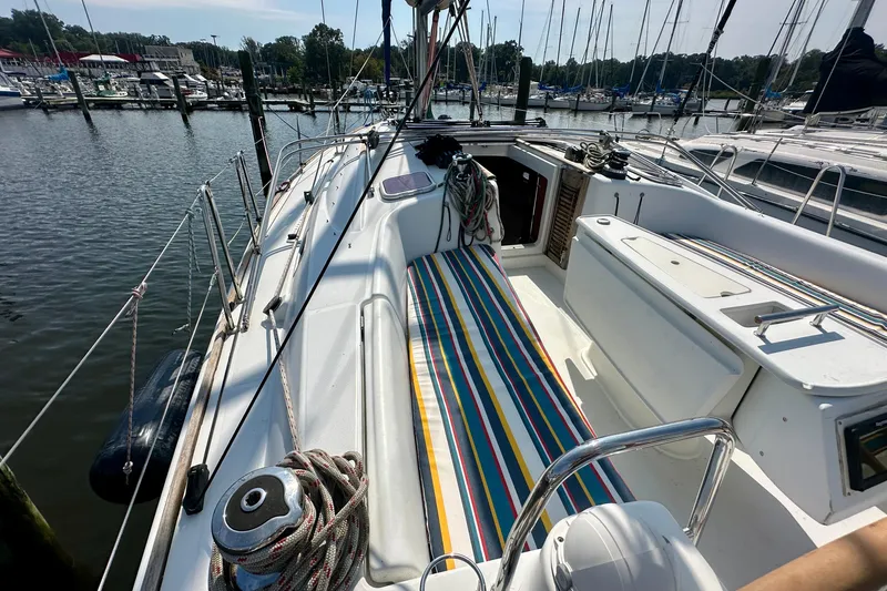 Slide: The Image of Sailing yacht Beneteau Oceanis 40, 2010 model, gliding on shimmering water under cloudy sky. - 12