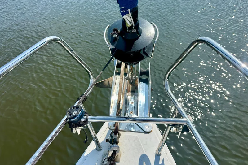 Slide: The Image of Deck view of 2010 Beneteau Oceanis 40 sailboat docked on calm water. - 18