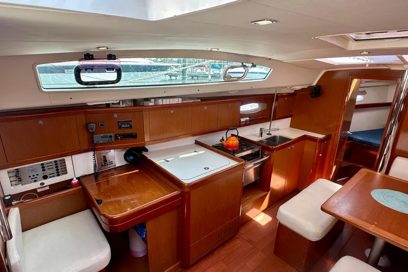 Slide: The Image of Deck of 2010 Beneteau Oceanis 40 sailboat with open hatch and rigging details. - 29