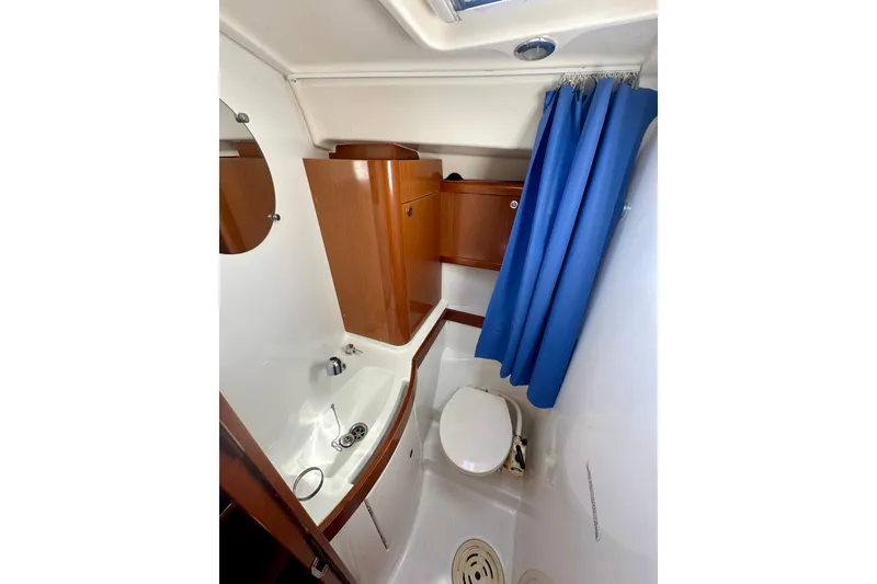 Slide: The Image of Interior of 2010 Beneteau Oceanis 40 yacht with cozy seating and wooden finishes. - 40