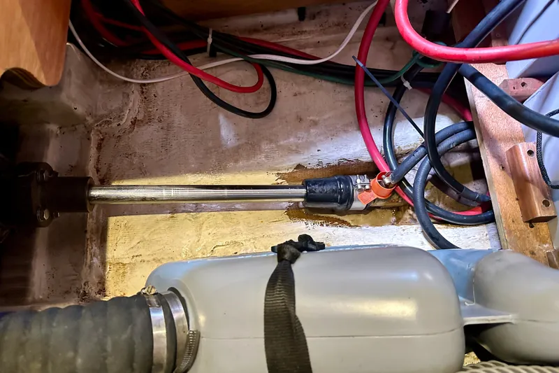 Slide: The Image of Control panel of a 2010 Beneteau Oceanis 40 sailboat, featuring various switches and indicators. - 46