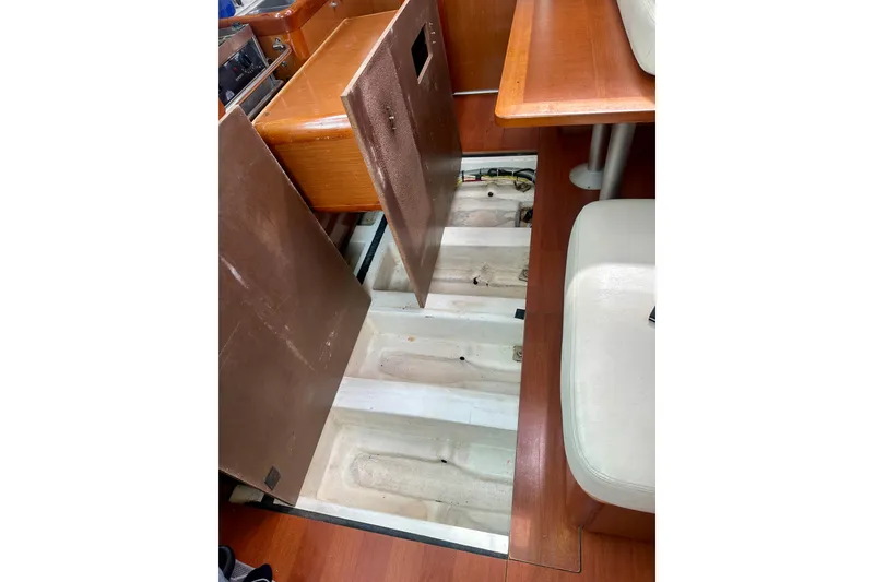 Slide: The Image of Cozy cabin interior of 2010 Beneteau Oceanis 40 sailboat with blue bedding. - 47