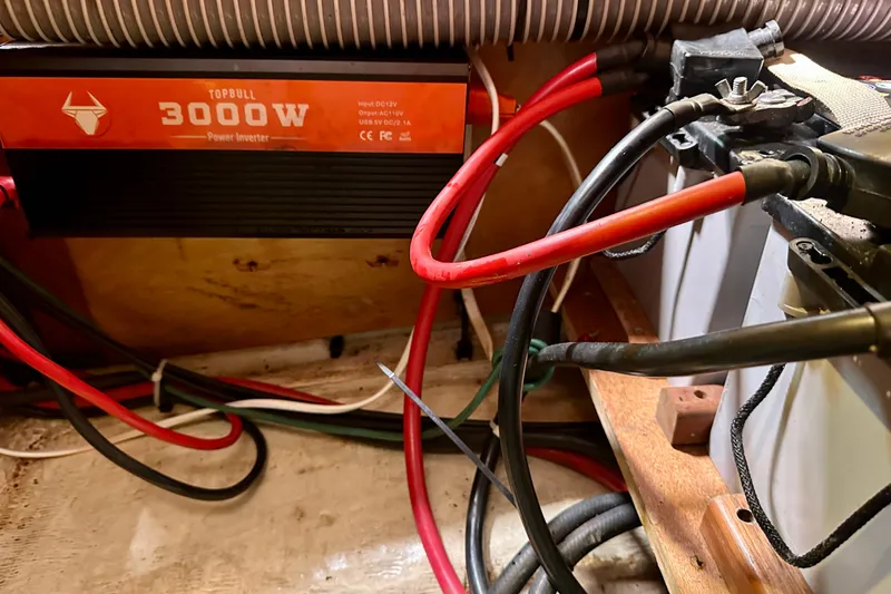 Slide: The Image of Engine compartment of a 2010 Beneteau Oceanis 40 sailboat, showing cables and components. - 54