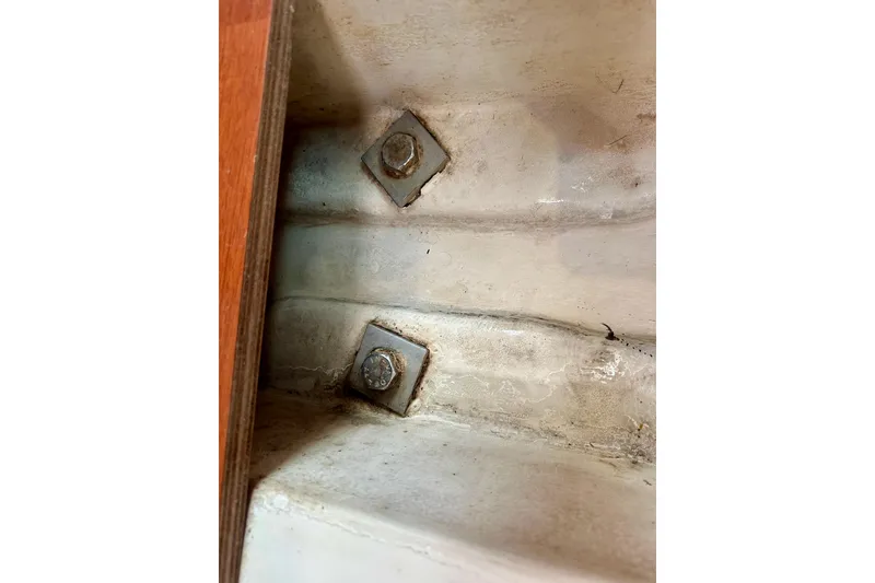 Slide: The Image of Close-up of bolts on a 2010 Beneteau Oceanis 40 sailboat interior. - 59