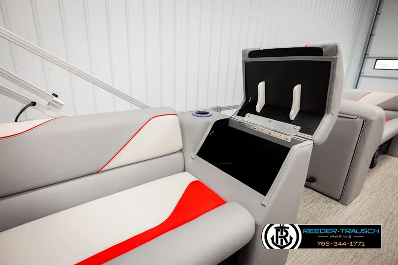 Slide: The Image of 2026 Avalon VEN85 VRB boat interior with open storage compartment, gray and red seating. - 21