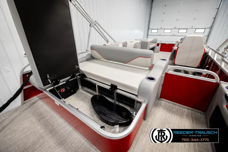 Slide: The Image of 2026 Avalon VEN85 VRB pontoon boat interior with red and gray seating, storage compartment open. - 27