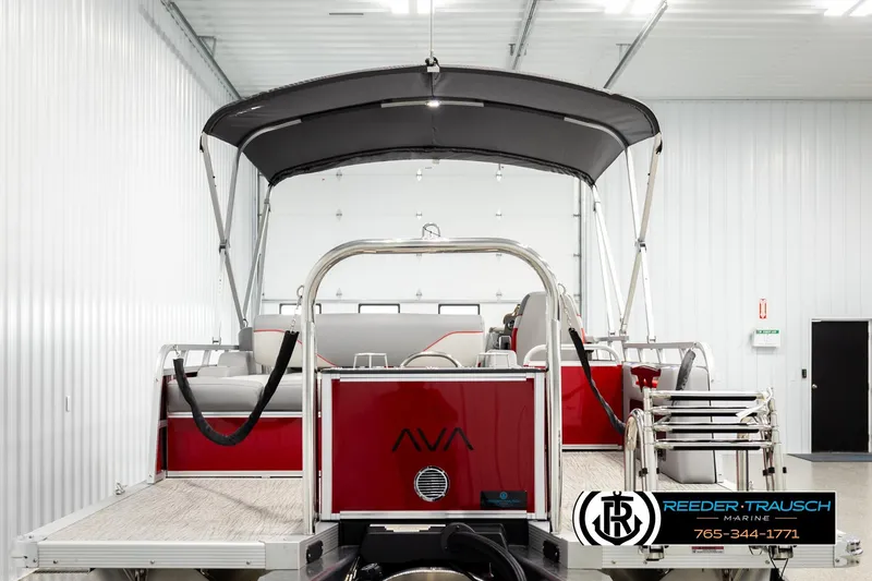 Slide: The Image of 2026 Avalon VEN85 VRB pontoon boat in showroom, featuring sleek design and canopy. - 7