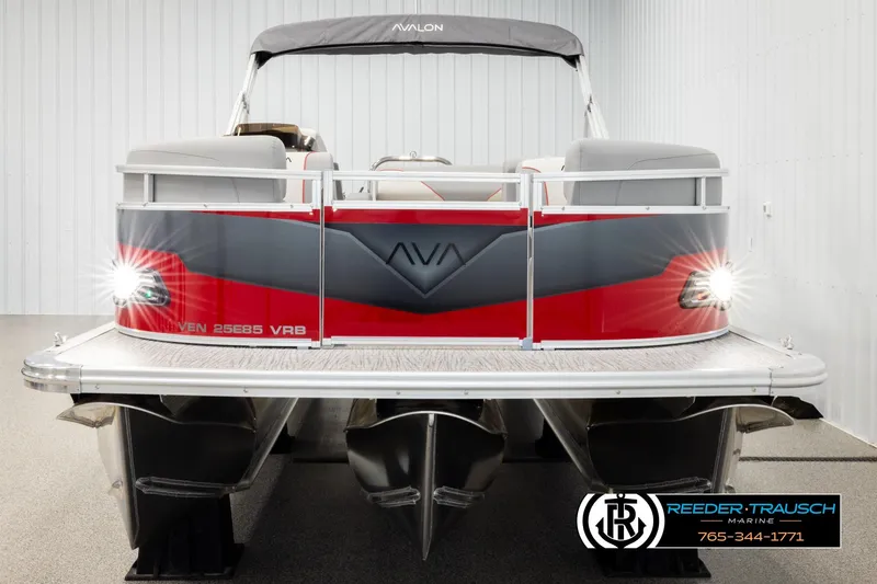 Slide: The Image of 2026 Avalon VEN85 VRB pontoon boat with sleek red and gray design in showroom. - 8