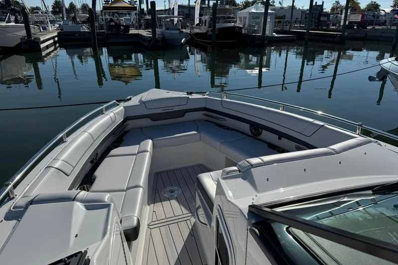 Slide: The Image of 2026 Formula 330 Crossover Bowrider OB, luxurious seating, docked at marina. - 11