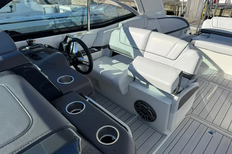 Slide: The Image of 2026 Formula 330 Crossover Bowrider OB interior with steering wheel and seating area. - 12