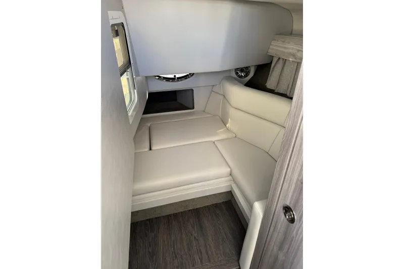 Slide: The Image of Interior cabin of 2026 Formula 330 Crossover Bowrider OB with white seating. - 14