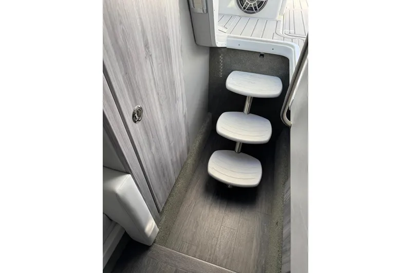 Slide: The Image of Interior steps of 2026 Formula 330 Crossover Bowrider OB boat, featuring sleek design. - 15