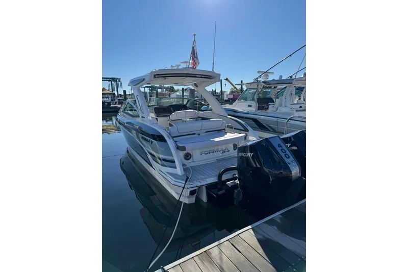 Slide: The Image of 2026 Formula 330 Crossover Bowrider OB docked, featuring dual Mercury 400 engines. - 3