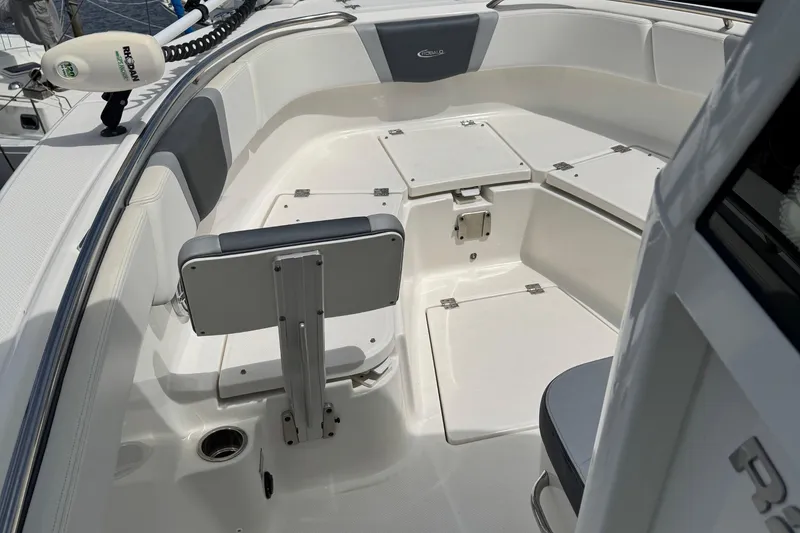 Slide: The Image of 2021 Robalo R272 Center Console boat interior with seating and storage compartments. - 17