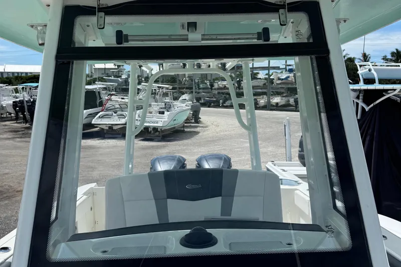 Slide: The Image of 2021 Robalo R272 Center Console boat interior view at a marina. - 20