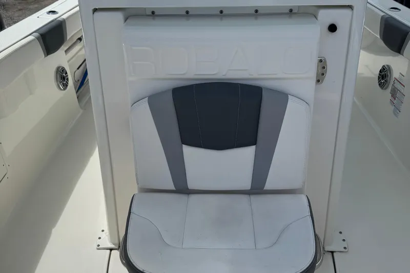 Slide: The Image of 2021 Robalo R272 Center Console boat seat, white and gray upholstery. - 21