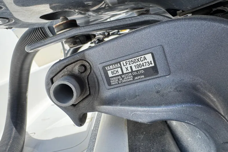 Slide: The Image of Close-up of Yamaha LF250XCA engine part on 2021 Robalo R272 Center Console boat. - 28