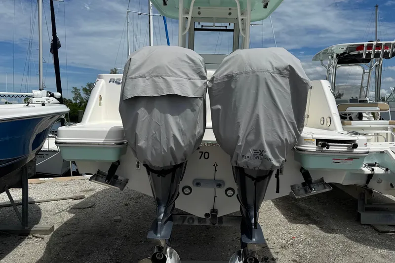 Slide: The Image of 2021 Robalo R272 Center Console with covered dual outboard motors. - 4