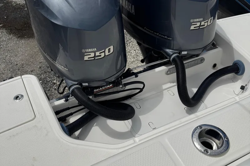 Slide: The Image of 2021 Robalo R272 Center Console with twin Yamaha 250 engines, rear view. - 5