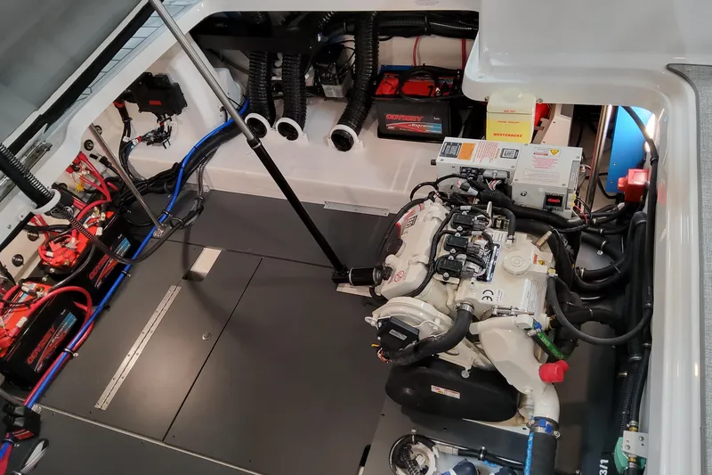 Slide: The Image of Engine compartment of 2026 Formula 330 Crossover Bowrider OB with visible wiring and components. - 20