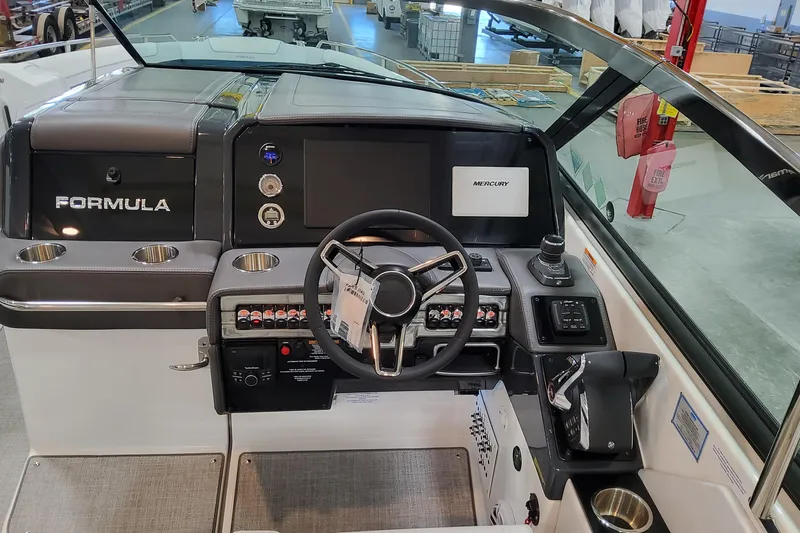 Slide: The Image of 2026 Formula 330 Crossover Bowrider OB helm with steering wheel and control panel. - 33