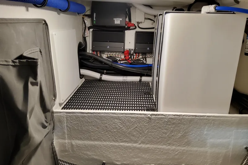 Slide: The Image of 2026 Formula 330 Crossover Bowrider OB engine compartment with electrical components and wiring. - 36