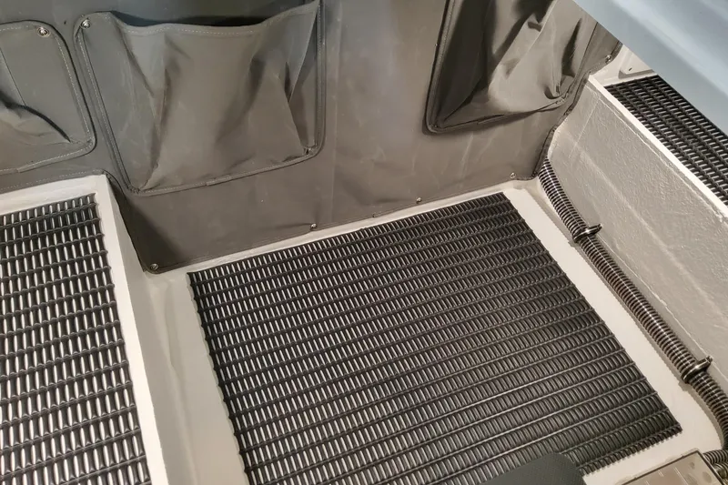 Slide: The Image of 2026 Formula 330 Crossover Bowrider OB interior with textured flooring and storage pockets. - 38