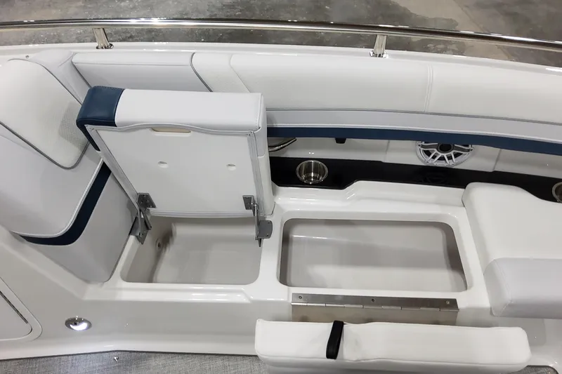 Slide: The Image of 2026 Formula 330 Crossover Bowrider OB interior seating with storage compartment open. - 46