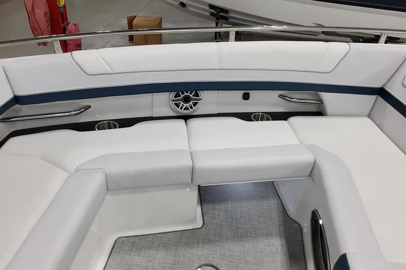 Slide: The Image of 2026 Formula 330 Crossover Bowrider OB interior with white seating and speaker detail. - 49