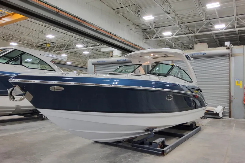 Slide: The Image of 2026 Formula 330 Crossover Bowrider OB in a showroom, showcasing sleek design and modern features. - 5