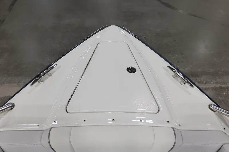 Slide: The Image of 2026 Formula 330 Crossover Bowrider OB, sleek white bow design, docked indoors. - 51