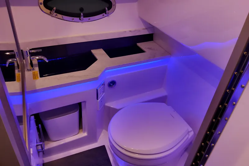 Slide: The Image of Luxury bathroom in 2026 Formula 330 Crossover Bowrider OB with modern fixtures and ambient lighting. - 61