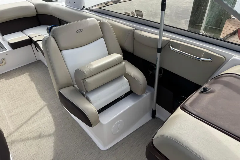 Slide: The Image of 2015 Regal 2700 Bowrider interior with beige seating and chrome accents. - 13