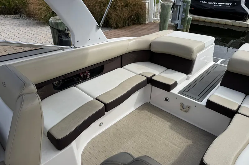 Slide: The Image of 2015 Regal 2700 Bowrider interior with beige seating and sleek design. - 15