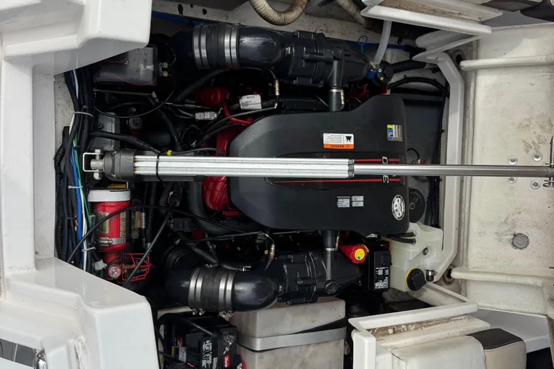 Slide: The Image of Engine compartment of a 2015 Regal 2700 Bowrider boat, showcasing mechanical components. - 17