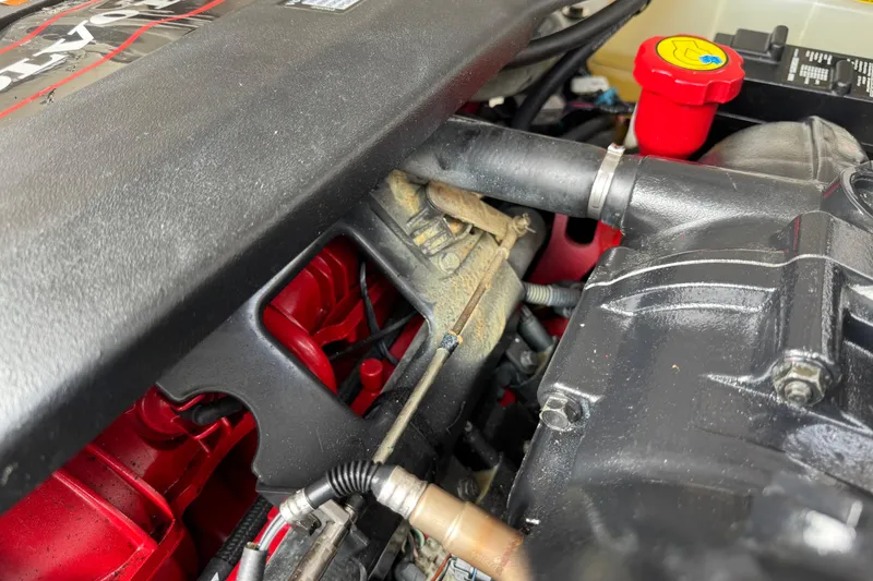 Slide: The Image of Engine compartment of a 2015 Regal 2700 Bowrider boat, showing detailed components. - 22