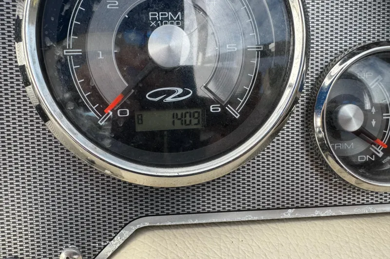Slide: The Image of Close-up of 2015 Regal 2700 Bowrider dashboard showing RPM gauge at 1400. - 23