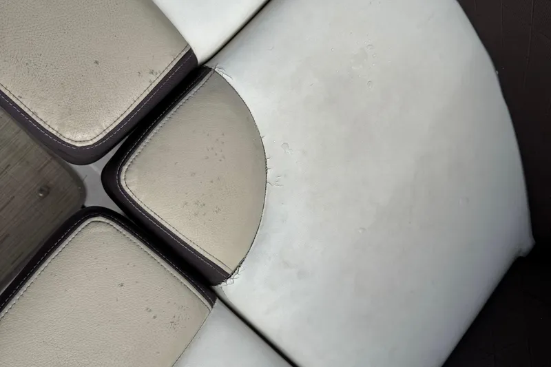 Slide: The Image of Worn seating upholstery on a 2015 Regal 2700 Bowrider boat. - 24