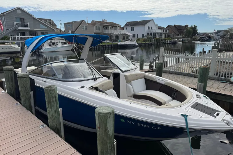 Slide: The Image of 2015 Regal 2700 Bowrider docked in a scenic waterfront neighborhood. - 3