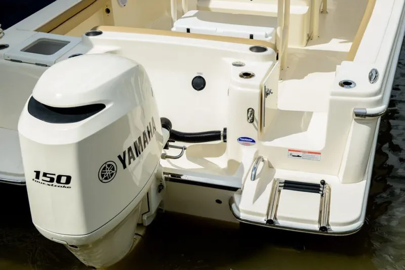 Slide: The Image of Manufacturer Provided Image: 2025 Scout 215 XSF boat with Yamaha 150 outboard motor, rear view. - 32