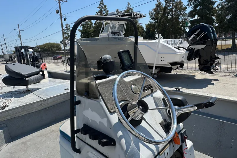 Slide: The Image of 2009 G3 1860 CC boat with steering wheel and Mercury outboard motor. - 10