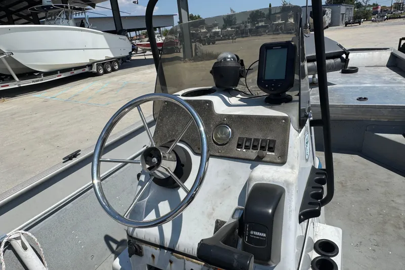Slide: The Image of 2009 G3 1860 CC boat console with steering wheel and navigation equipment. - 7