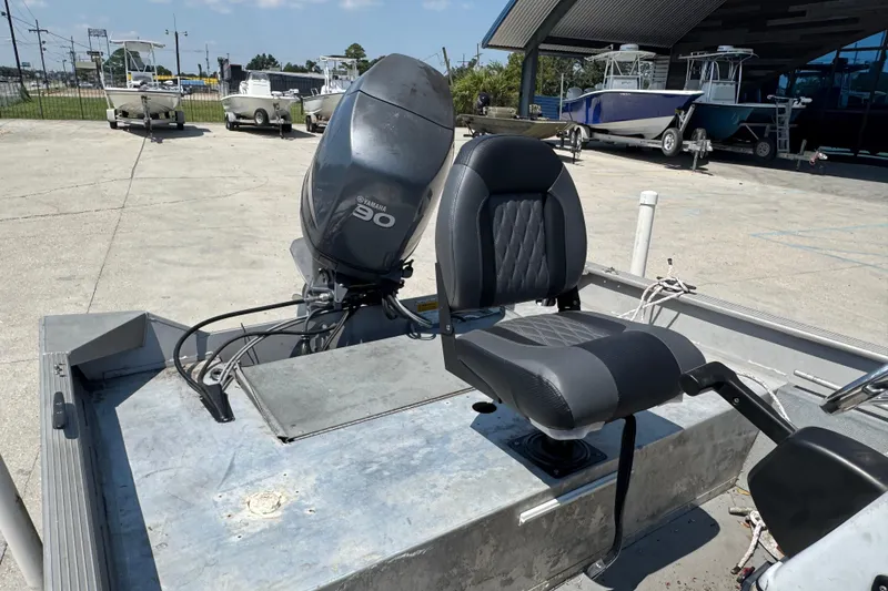 Slide: The Image of 2009 G3 1860 CC boat with Yamaha 90 engine, parked outdoors. - 8