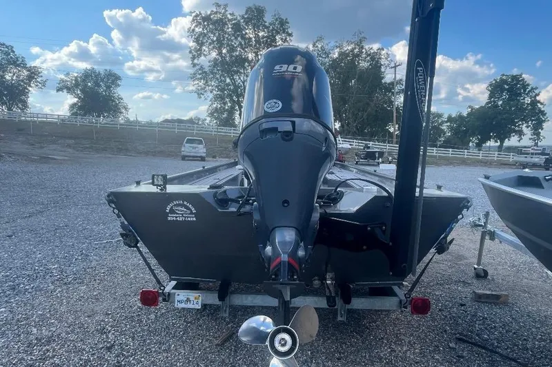 Slide: The Image of 2021 Weld-Craft 1860 PF boat with 90 HP engine on a trailer, parked outdoors. - 4